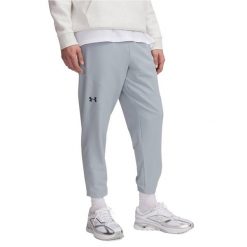Spodnie treningowe męskie Under Armour Unstoppable Tapered. Niebieskie buty treningowe Under Armour, bez wzorów, na fitness i siłownię. Za 299.99 zł.