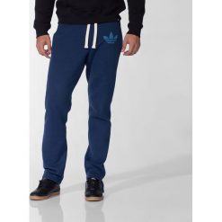 Adidas Spodnie męskie Slim Sweatpants granatowy r. XS (M69898). Spodnie treningowe długie Adidas. Za 132.78 zł.
