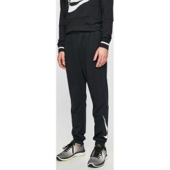 Nike - Spodnie. Szare spodnie treningowe długie Nike, m, bez wzorów, z materiału. W wyprzedaży za 149.90 zł.