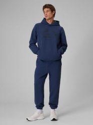 4F Spodnie dresowe joggery męskie - granatowe M. Niebieskie spodnie materiałowe 4F, na co dzień, m, bez wzorów, z dresówki, klasyczne. Za 179.99 zł.