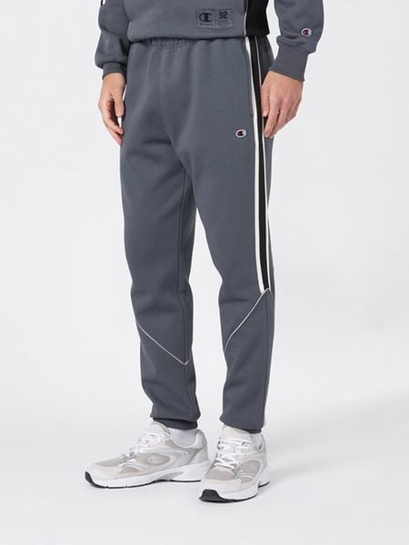 Champion Spodnie dresowe w kolorze szarym rozmiar: L. Szare spodnie treningowe długie Champion, l, bez wzorów, z bawełny. Za 122.38 zł.