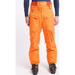 Spodnie narciarskie męskie SPMN553 - pomarańcz. Brązowe spodnie narciarskie i snowboardowe 4F, m, bez wzorów, z materiału. W wyprzedaży za 149.99 zł.