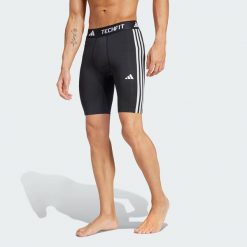 Legginsy TECHFIT Compression Training 3-Stripes Short. Czarne legginsy długie sportowe Adidas, xs, bez wzorów, z materiału, na fitness i siłownię, techfit (adidas). Za 179.00 zł.