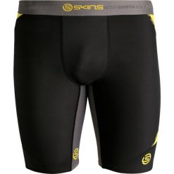 Skins DNAMIC Legginsy black/citron. Spodnie treningowe długie marki Skins, z elastanu. W wyprzedaży za 254.15 zł.