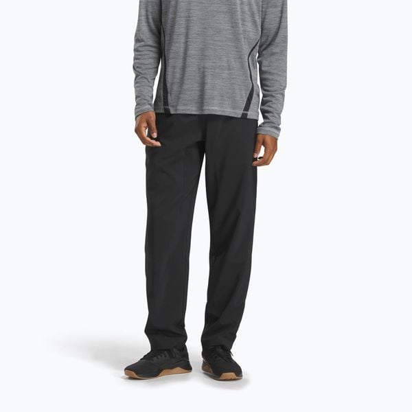 Spodnie treningowe męskie Reebok Id Train Woven Unlined. Czarne buty treningowe REEBOK FITNESS, bez wzorów, na fitness i siłownię. W wyprzedaży za 155.60 zł.