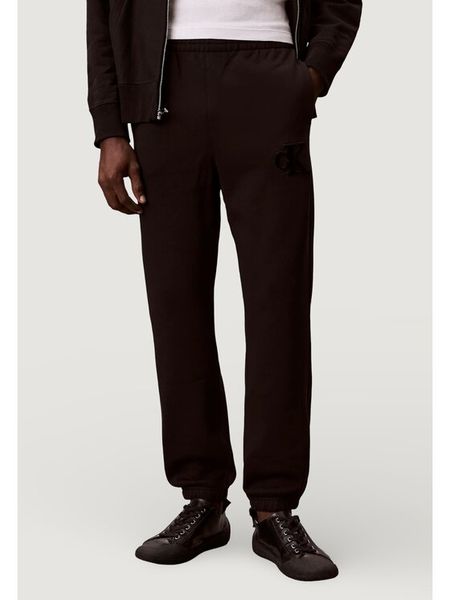 Calvin Klein Jeans Spodnie dresowe 350GSM FLEECE GIFT G Czarny Casual Fit. Czarne spodnie materiałowe Calvin Klein Jeans, na co dzień, m, bez wzorów, z dresówki, casualowe. Za 389.99 zł.