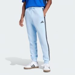 Spodnie Essentials 3-Stripes Fleece. Czarne spodnie treningowe długie Adidas, l, bez wzorów, z materiału. Za 174.00 zł.