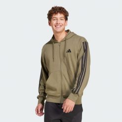 Bluza z kapturem Essentials 3-Stripes French Terry Full-Zip. Czarne bluzy z kapturem Adidas, xs, bez wzorów, z materiału, z kapturem. Za 299.00 zł.