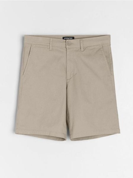 Szorty chino - beżowy. Brązowe krótkie spodenki sportowe Sinsay, l, bez wzorów. W wyprzedaży za 29.99 zł.