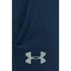Under Armour - Spodnie Storm Armour. Niebieskie spodnie treningowe długie Under Armour, l, bez wzorów, z dzianiny. W wyprzedaży za 239.90 zł.
