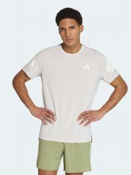 Adidas Koszulka w kolorze beżowym do biegania rozmiar: XXL. Brązowe t-shirty sportowe Adidas, bez wzorów, bez ramiączek, do biegania. Za 119.95 zł.