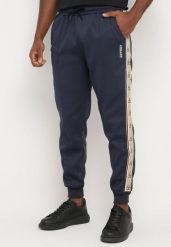 Granatowe Spodnie Dresowe ze Ściągaczem Zdobione Lampasem z Polarową Podszewką Edittia. Niebieskie spodnie materiałowe Born2be, na co dzień, m, z aplikacjami, z dresówki, eleganckie. Za 59.99 zł.