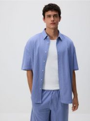 Koszula oversize w paski - niebieski. Niebieskie koszule Reserved, l, bez wzorów, z bawełny, bez kołnierzyka, bez ramiączek. Za 99.99 zł.