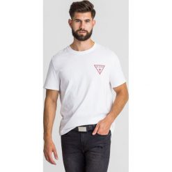 T-SHIRT DRIVE OFF Guess. Białe t-shirty Guess, l, z aplikacjami, z bawełny, bez kołnierzyka, bez ramiączek. Za 139.00 zł.