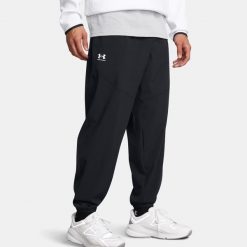 Spodnie męskie Under Armour Vibe Woven Jogger black/white. Czarne joggery i bojówki Under Armour, m, bez wzorów, sportowe. Za 319.99 zł.