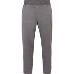 Grube joggery z rozcięciem, barwione w dresie Urban Classics. Czarne joggery i bojówki Urban Classics, m, bez wzorów, z dresówki. Za 275.00 zł.
