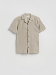 Strukturalna koszula regular fit - beżowy. Brązowe koszule Reserved, l, bez wzorów, z dzianiny, bez kołnierzyka, bez ramiączek. Za 129.99 zł.