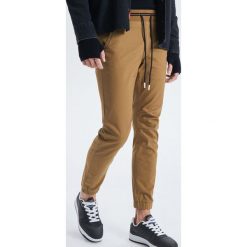 Spodnie slim jogger - Beżowy. Joggery i bojówki marki Cropp. Za 119.99 zł.