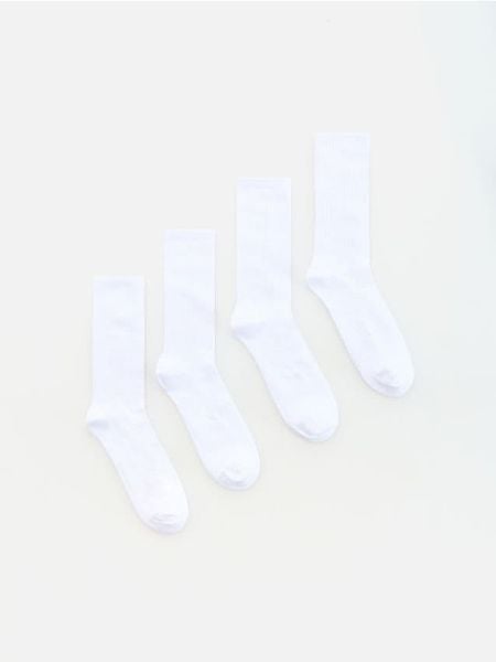 4 pack długich skarpet - biały. Białe skarpety Reserved, bez wzorów. Za 49.99 zł.