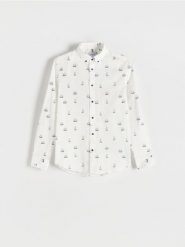 Bawełniana koszula slim fit - jasnoniebieski. Niebieskie koszule Reserved, l, bez wzorów, z bawełny, bez kołnierzyka, bez ramiączek. Za 99.99 zł.