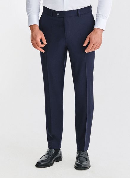 PAKO LORENTE - Wełniane granatowe spodnie garniturowe. Garnitury Pako Lorente, do pracy, m, bez wzorów, z wełny. Za 999.99 zł.