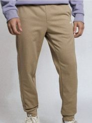 Spodnie dresowe jogger - beżowy. Brązowe joggery i bojówki Sinsay, l, bez wzorów, z dresówki. Za 39.99 zł.