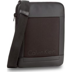 Saszetka CALVIN KLEIN - Caillou Flat Crosso K50K502835 001. Saszetki i nerki marki CALVIN KLEIN. W wyprzedaży za 209.00 zł.