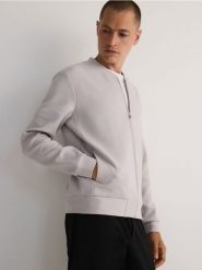 Bluza bomberka - złamana biel. Kurtki Reserved, l, bez wzorów, z bawełny, bez kaptura. W wyprzedaży za 79.99 zł.