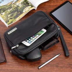 Czarna skórzana saszetka męska do ręki Beltimore R09. Czarne torby na ramię bez wzorów, do ręki, bez dodatków. Za 99.90 zł.