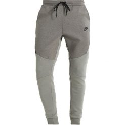 Nike Sportswear TECH JOGGER Spodnie treningowe dark stucco/heather/black. Joggery i bojówki marki Nike Sportswear. Za 319.00 zł.