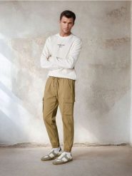 Spodnie jogger - zielony. Zielone joggery i bojówki Sinsay, m, bez wzorów, z bawełny. Za 59.99 zł.