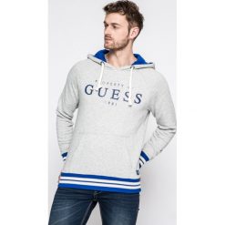 Guess Jeans - Bluza. Bluzy z kapturem marki Guess Jeans, z aplikacjami, z bawełny. W wyprzedaży za 219.90 zł.
