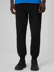 4F Spodnie dresowe w kolorze czarnym rozmiar: XL. Czarne spodnie treningowe długie 4F, xl, bez wzorów, z bawełny. Za 96.60 zł.