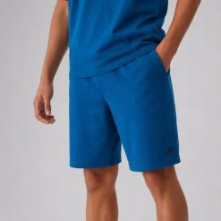 SPODENKI DRESOWE MĘSKIE 4F SPORTOWE TSHOM543 PRZED KOLANO KOLOR ZIELONY. Zielone krótkie spodenki sportowe 4F, l, bez wzorów, z bawełny. Za 79.99 zł.