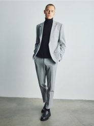 Spodnie garniturowe slim fit - jasnoszary. Szare garnitury Reserved, l, bez wzorów, z tkaniny. Za 169.99 zł.