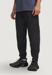 Spodnie Mężczyzna UNDER ARMOUR UA UNSTOPPABLE FLC JOGGERS. Czarne joggery i bojówki Under Armour, m, bez wzorów, z bawełny, sportowe. Za 603.99 zł.