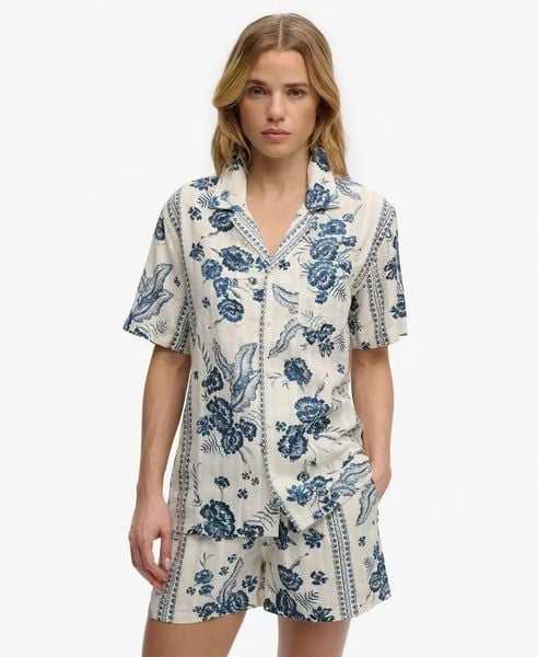 Superdry Koszula krótki rękaw Beach Jeane Floral Cream. Białe koszule Superdry, na lato, bez wzorów, z bawełny, bez kołnierzyka, bez ramiączek. Za 215.35 zł.