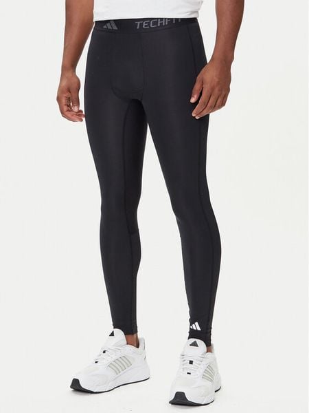 Adidas Legginsy Techfit Compression IN5590 Czarny Slim Fit. Czarne legginsy długie sportowe Adidas, m, bez wzorów, z syntetyku, na fitness i siłownię, techfit (adidas). Za 139.99 zł.