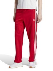 Adidas Spodnie dresowe w kolorze czerwonym rozmiar: XL. Czerwone spodnie treningowe długie Adidas, xl, bez wzorów, z dresówki. Za 153.71 zł.
