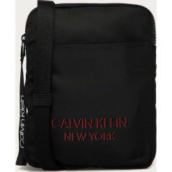 Calvin Klein - Saszetka. Czarne saszetki i nerki CALVIN KLEIN, bez wzorów. W wyprzedaży za 179.90 zł.