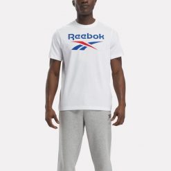 Koszulka fitness męska Reebok krótki rękaw. Niebieskie bluzki z długim rękawem Reebok, m, bez wzorów, z bawełny, bez kołnierzyka, bez ramiączek. W wyprzedaży za 59.99 zł.