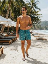 Szorty kąpielowe z motywem palm - wielobarwny. Krótkie spodenki sportowe Sinsay, l, bez wzorów. W wyprzedaży za 19.99 zł.