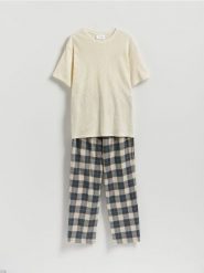 Dwuczęściowa piżama - kremowy. Białe piżamy Reserved, l, bez wzorów, z bawełny, bez ramiączek. Za 139.99 zł.