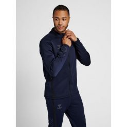 Bluza dresowa zapinana na zamek błyskawiczny Hummel Cima XK. Niebieskie bluzy bez kaptura Hummel, s, bez wzorów, z dresówki, bez kaptura. W wyprzedaży za 308.05 zł.