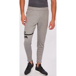 Under Armour - Spodnie. Spodnie treningowe długie Under Armour. W wyprzedaży za 159.90 zł.