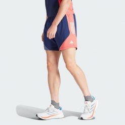 Szorty Own The Run Colorblock. Czerwone buty do biegania Adidas, bez wzorów, z materiału, bez zapięcia, na fitness i siłownię. W wyprzedaży za 136.05 zł.