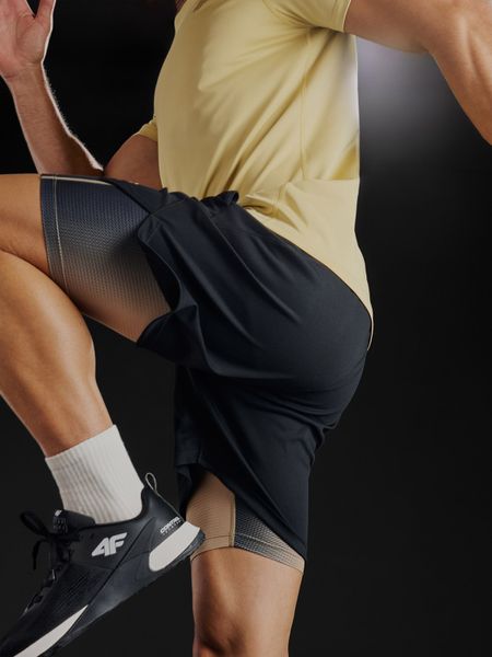 4F Spodenki treningowe szybkoschnące męskie - czarne M. Czarne krótkie spodenki sportowe 4F, l, bez wzorów, z materiału. Za 169.99 zł.