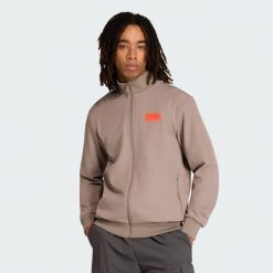 BLUZA DRESOWA AUDI REVOLUT F1 TEAM ELEVATED. Brązowe bluzy bez kaptura Adidas, l, bez wzorów, z dresówki, bez kaptura. Za 529.00 zł.