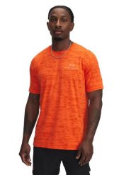 Under Armour Koszulka sportowa w kolorze pomarańczowym rozmiar: L. Pomarańczowe t-shirty sportowe Under Armour, bez wzorów, z materiału, bez ramiączek, outdoorowe. Za 144.24 zł.