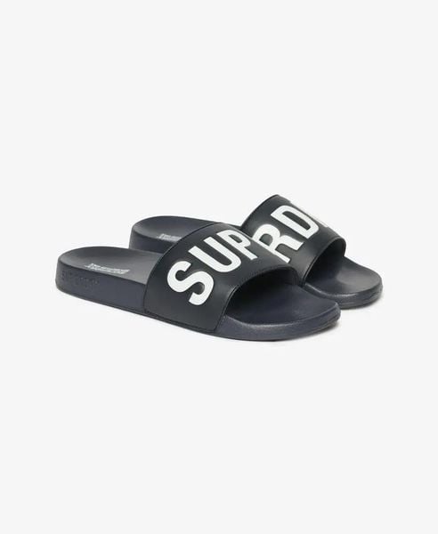 Superdry Core Pool Sliders - Klapki z wyściełanym paskiem – Deep Navy/Optic. Niebieskie klapki Superdry. Za 174.20 zł.